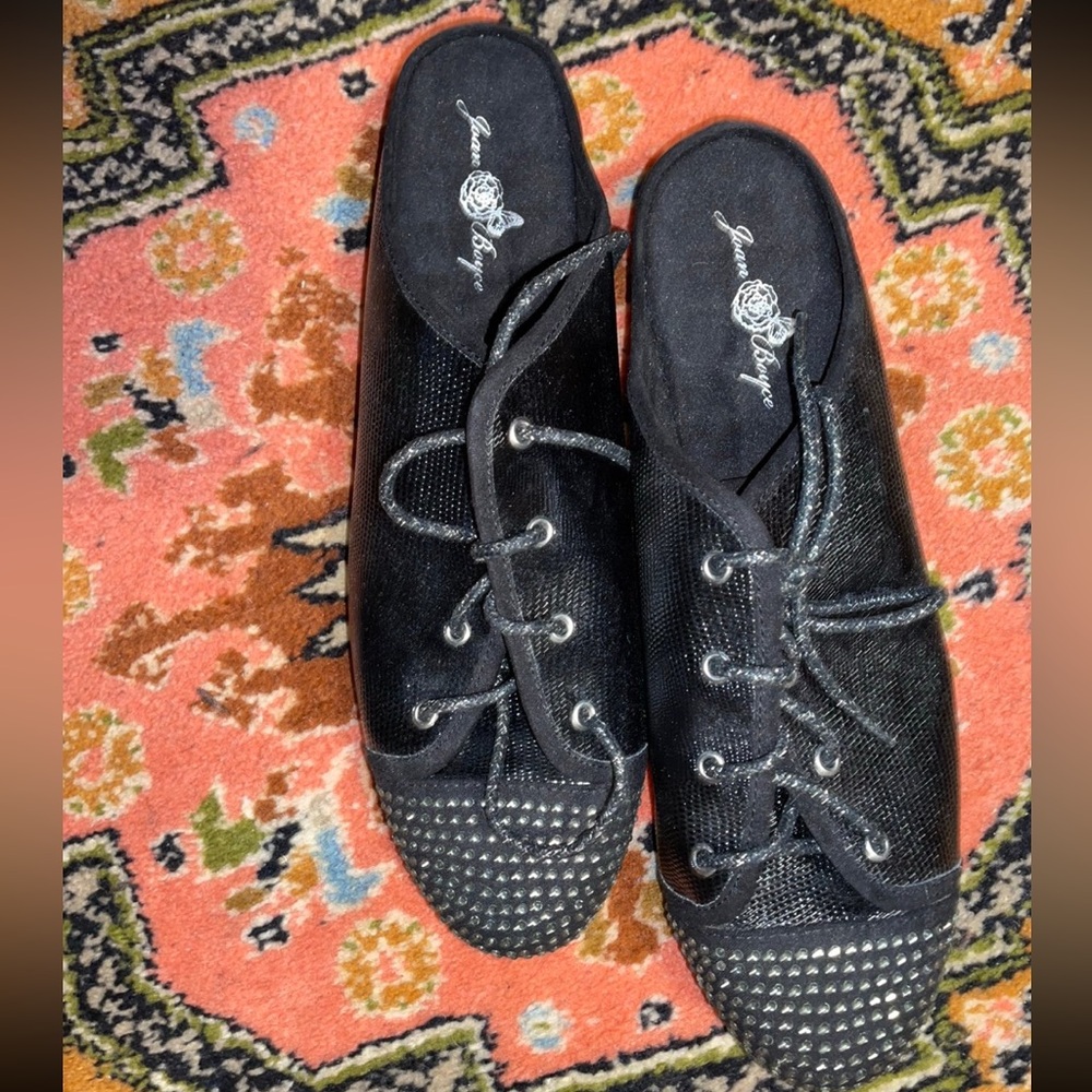 Joan Boyce studed black lace up open back sneakers
